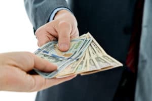 businessman hands giving money.