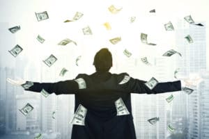 Young businessman with dollar money