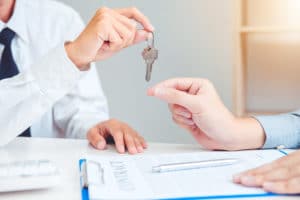 Sale agent giving Key house