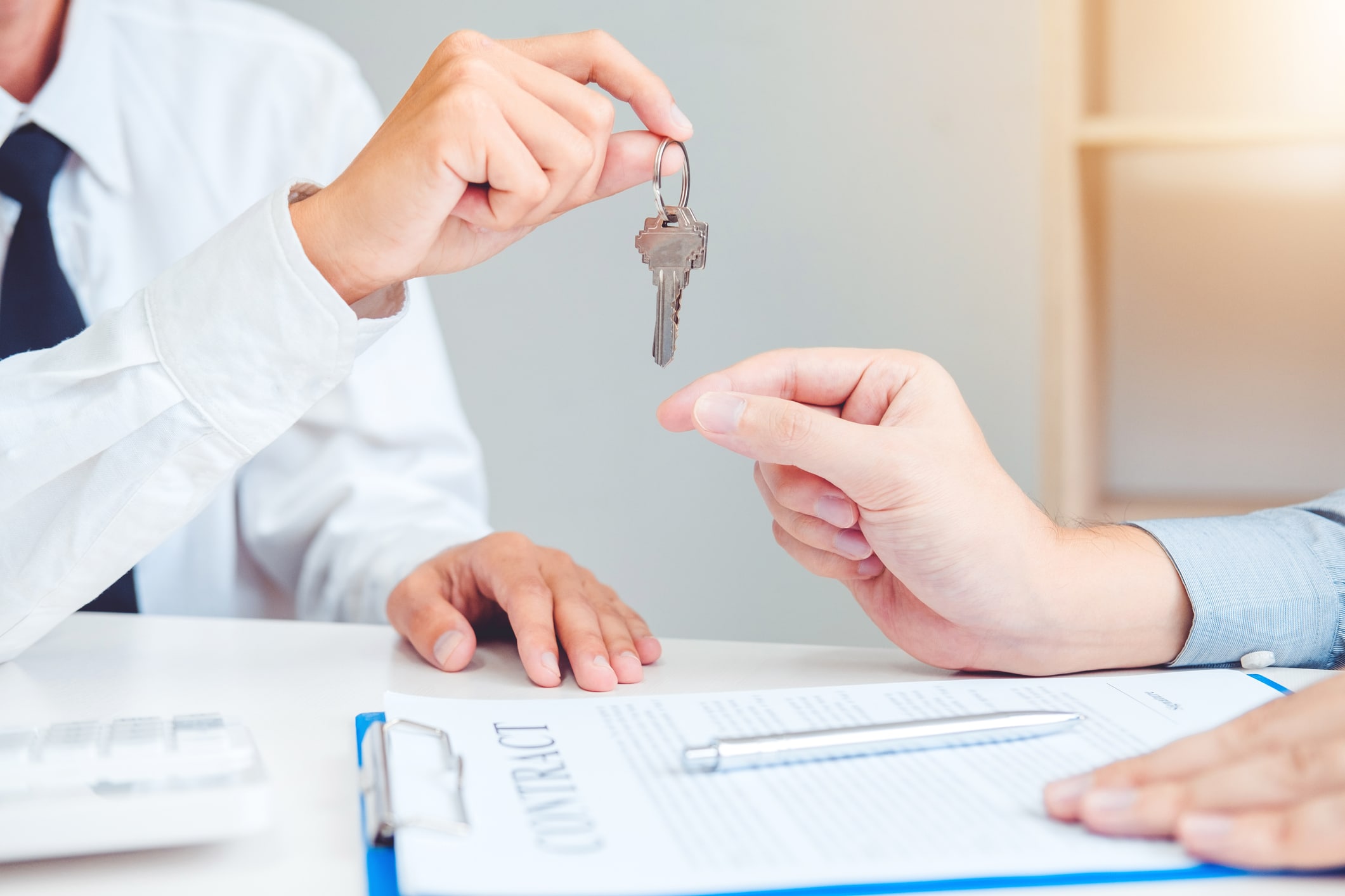 Sale agent giving Key house